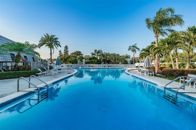 view of swimming pool with a patio