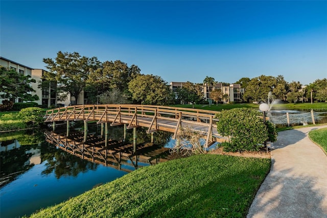 surrounding community with a water view