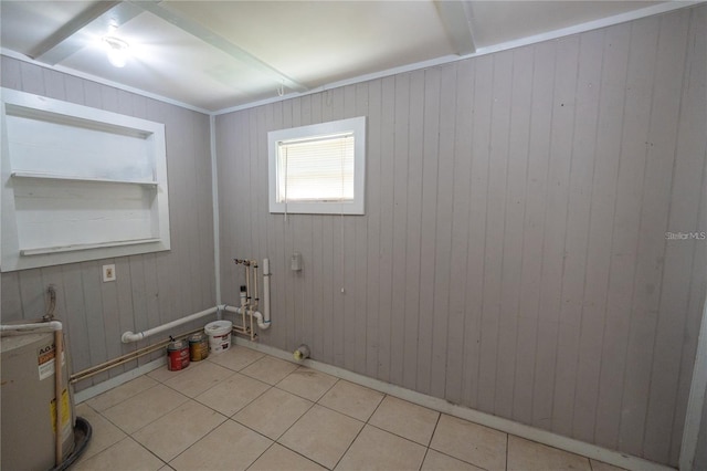 interior space with wooden walls and light tile patterned floors