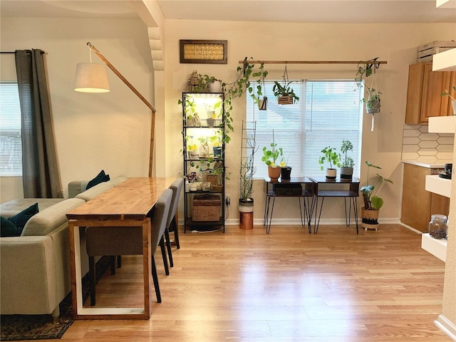 dining room with light wood-type flooring