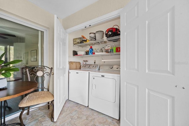 clothes washing area with washer and dryer