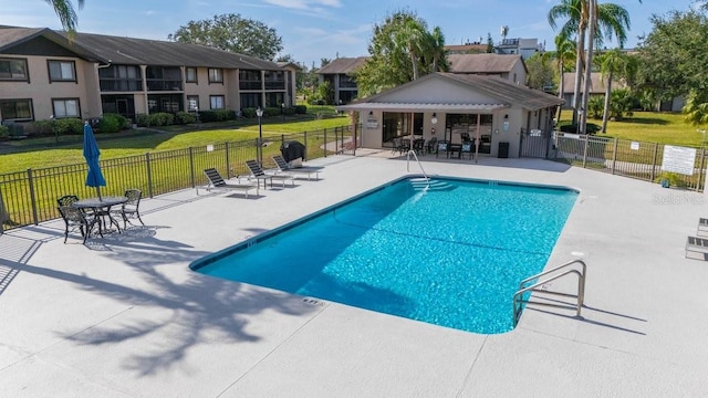 view of swimming pool featuring a pergola and a patio area