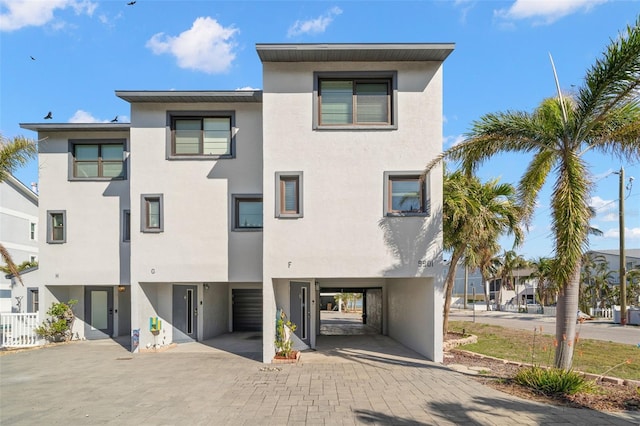 view of front of property featuring a carport