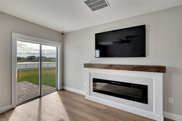 unfurnished living room featuring light hardwood / wood-style flooring