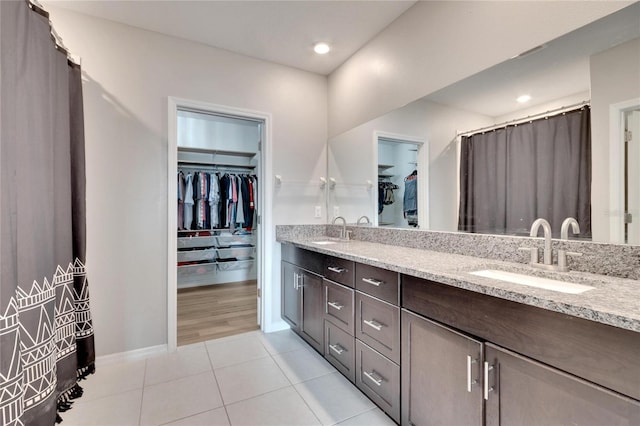 bathroom with tile patterned floors and vanity