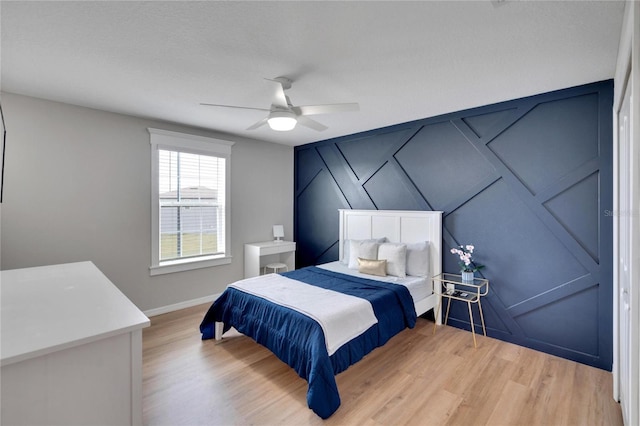 bedroom featuring ceiling fan and light wood-type flooring