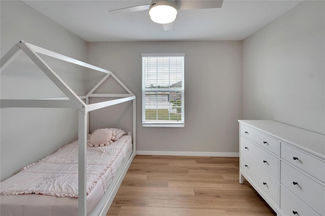 bedroom featuring ceiling fan and light hardwood / wood-style flooring