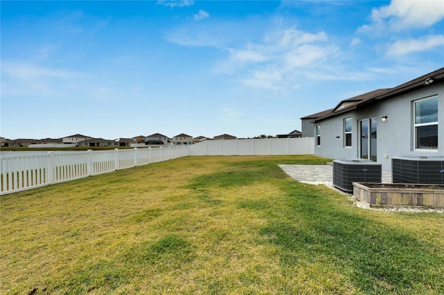 view of yard featuring cooling unit and a patio