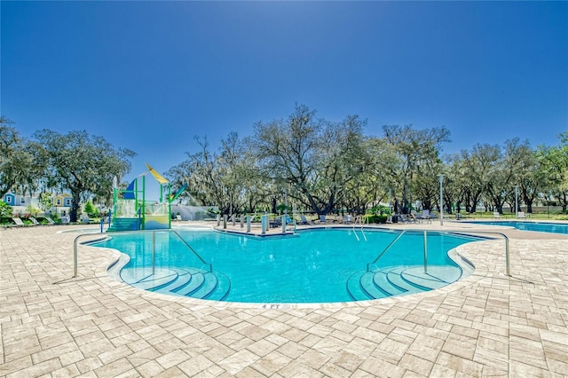 view of pool featuring a patio