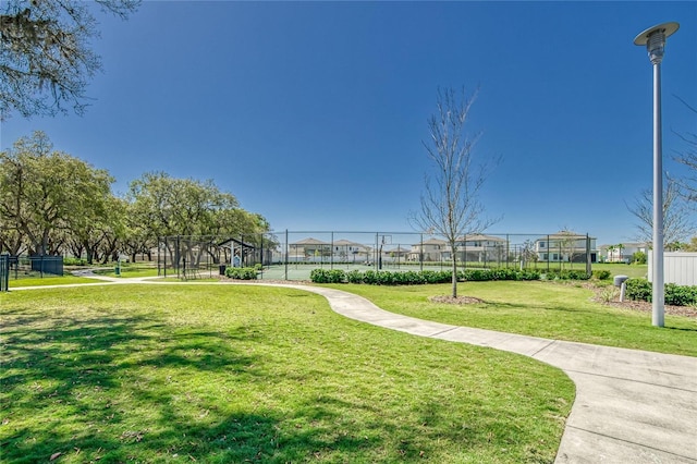 view of property's community featuring a yard