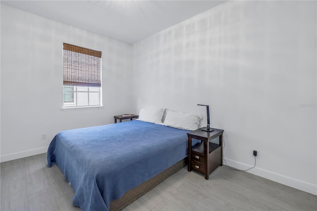 bedroom with wood-type flooring