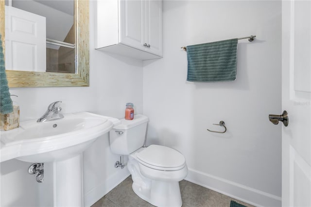 bathroom featuring tile patterned flooring and toilet