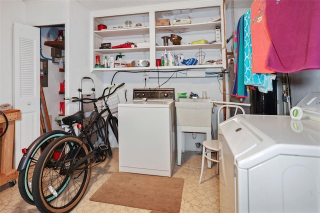 laundry area featuring sink and washer and dryer