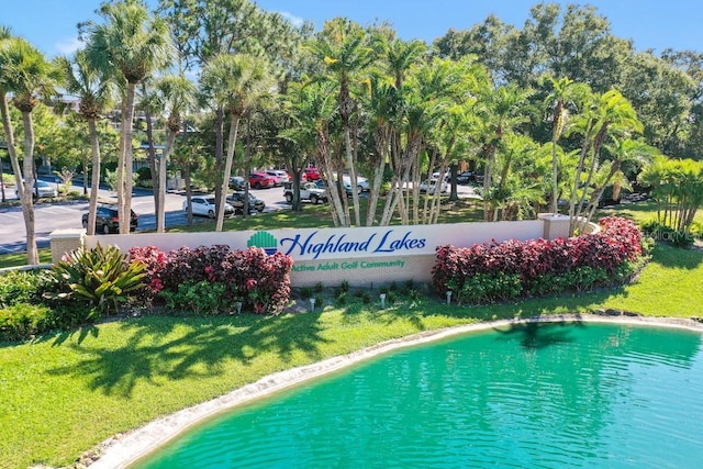 2740 Highlands Blvd Unit D, Palm Harbor, FL 34684 - view of pool featuring a lawn