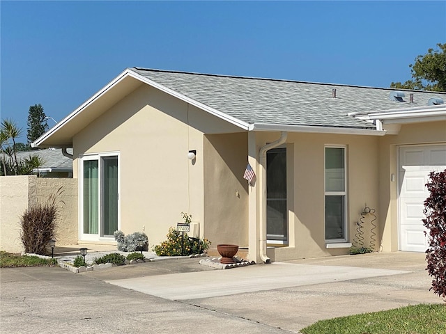 view of exterior entry with a garage