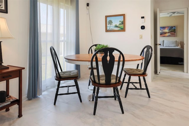 dining room featuring ceiling fan