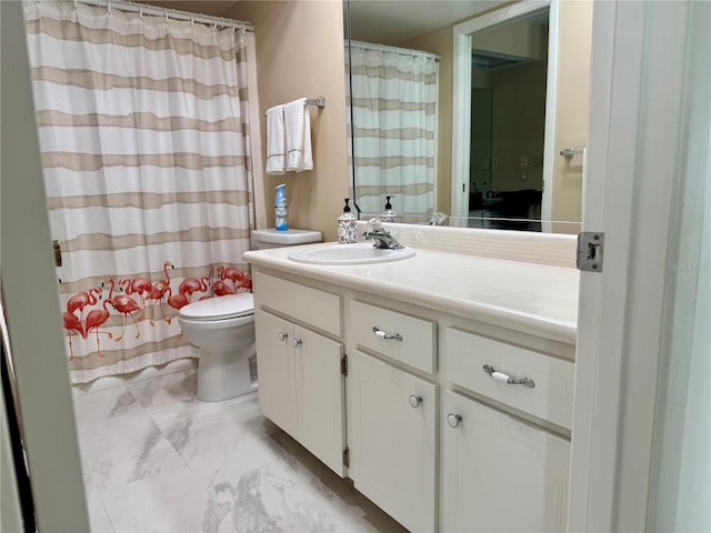 bathroom featuring vanity, toilet, and walk in shower