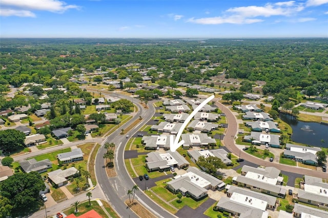 2740 Highlands Blvd Unit D, Palm Harbor, FL 34684 - aerial perspective of suburban area with a nearby body of water and a forest