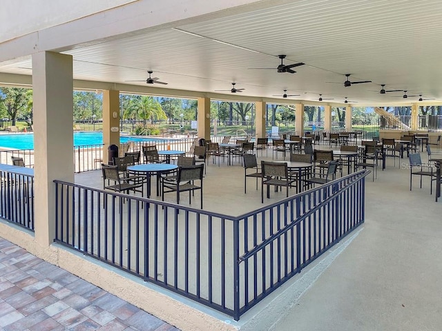 2740 Highlands Blvd Unit D, Palm Harbor, FL 34684 - view of patio with ceiling fan and a community pool
