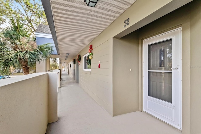 view of patio featuring a balcony