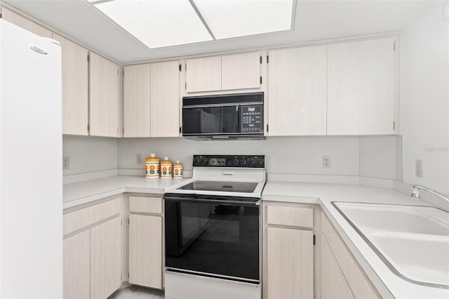 kitchen featuring sink and white appliances