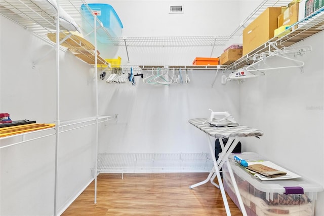 walk in closet featuring hardwood / wood-style flooring