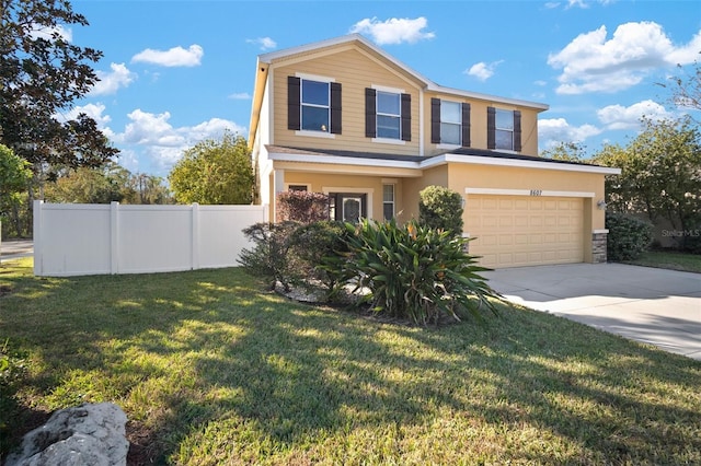 view of front of house with a garage and a front lawn