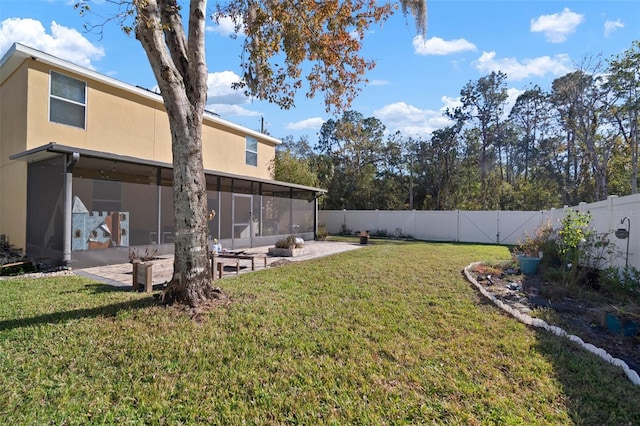 view of yard with a patio area and a sunroom