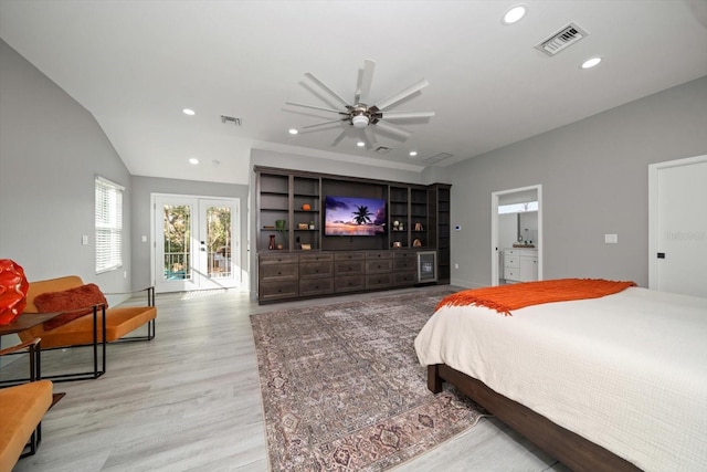 bedroom featuring access to outside, french doors, ensuite bath, ceiling fan, and light wood-type flooring