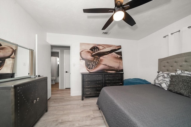 bedroom with light wood-type flooring and ceiling fan