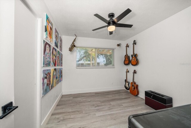 bedroom with ceiling fan and light hardwood / wood-style floors