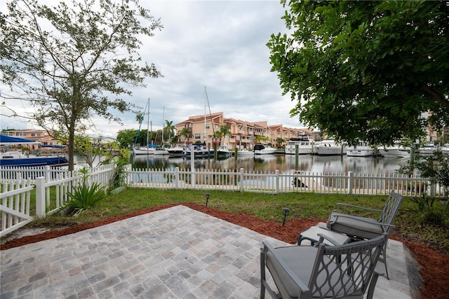 view of patio with a water view