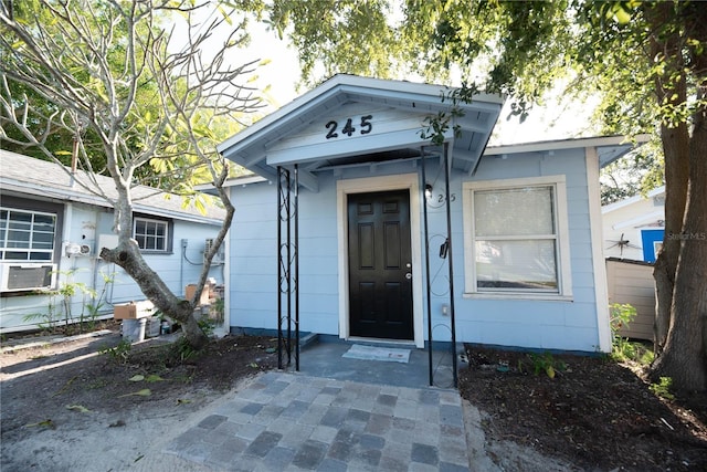 doorway to property with cooling unit