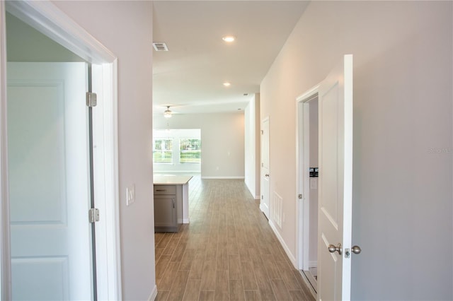 hall with light hardwood / wood-style flooring