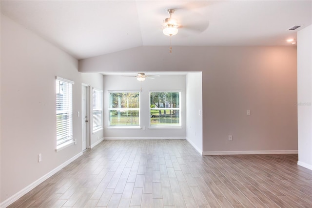 unfurnished room featuring ceiling fan, light hardwood / wood-style floors, and lofted ceiling