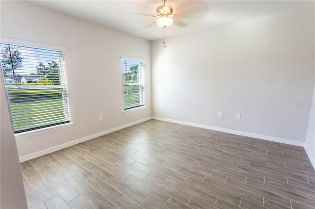 unfurnished room featuring ceiling fan and wood-type flooring