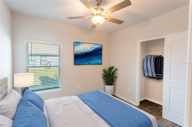 bedroom with dark hardwood / wood-style flooring, a closet, and ceiling fan