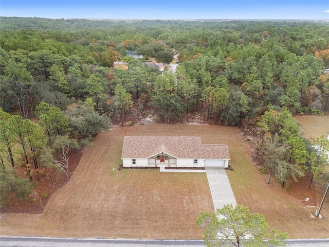 5421 N Nakoma Dr, Beverly Hills, FL 34465 - view from above of property featuring a heavily wooded area