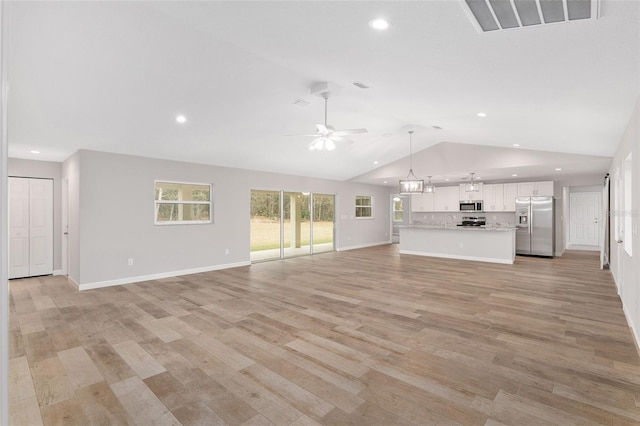 5421 N Nakoma Dr, Beverly Hills, FL 34465 - unfurnished living room with vaulted ceiling, ceiling fan, recessed lighting, and light wood-style flooring