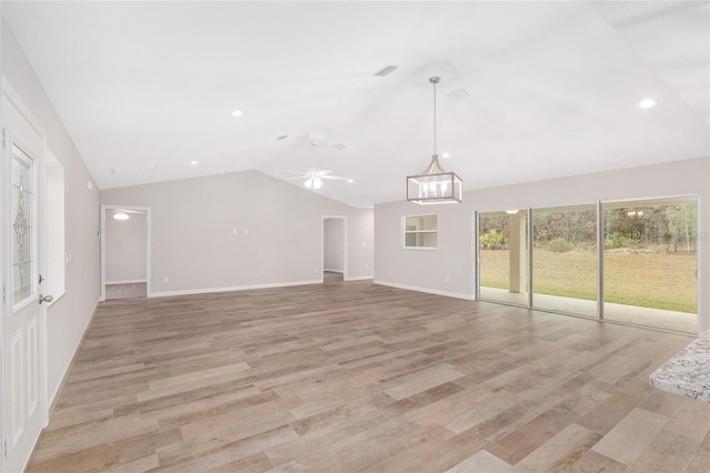 unfurnished living room with light wood-type flooring, vaulted ceiling, and ceiling fan