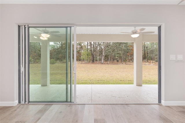5421 N Nakoma Dr, Beverly Hills, FL 34465 - doorway with a ceiling fan and wood finished floors