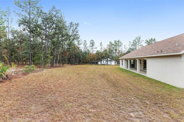 5421 N Nakoma Dr, Beverly Hills, FL 34465 - view of green lawn featuring a patio