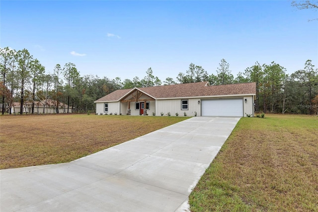 ranch-style house featuring a garage and a front yard