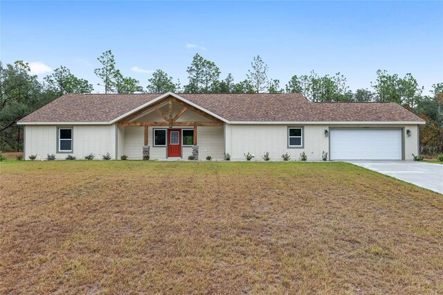 5421 N Nakoma Dr, Beverly Hills, FL 34465 - ranch-style house featuring an attached garage, driveway, and a front lawn