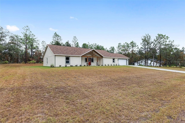 view of front of home with a garage and a front yard