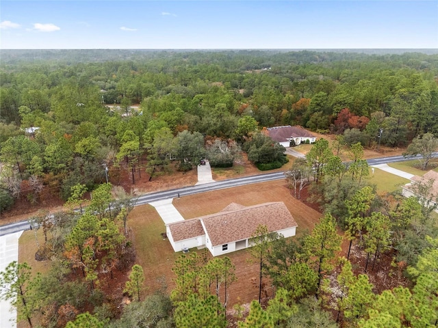 5421 N Nakoma Dr, Beverly Hills, FL 34465 - view from above of property with a heavily wooded area
