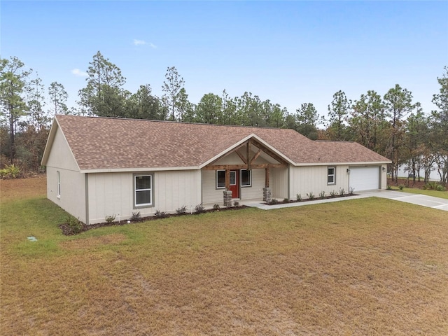 ranch-style house with a garage and a front lawn