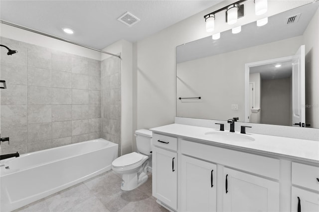 full bathroom featuring vanity, toilet, and tiled shower / bath