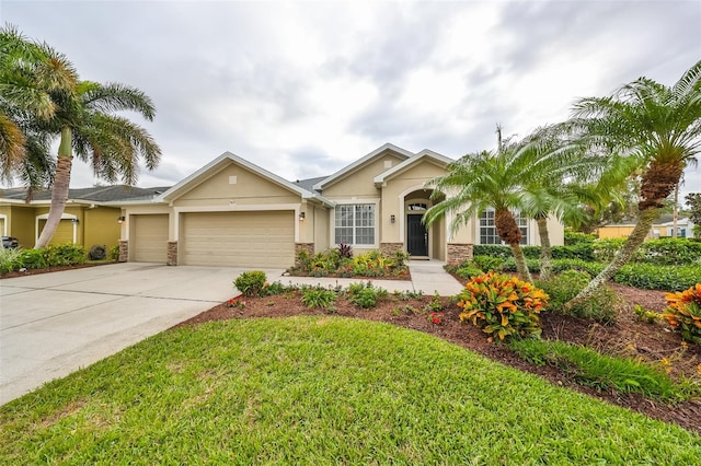 view of front of property with a front lawn and a garage