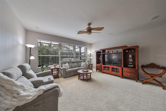 living room with carpet and ceiling fan